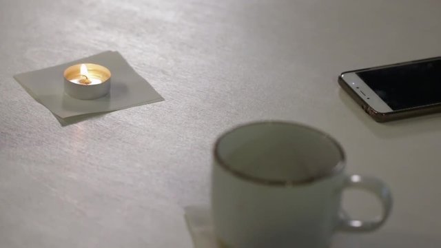 Candle, Cup and Phone