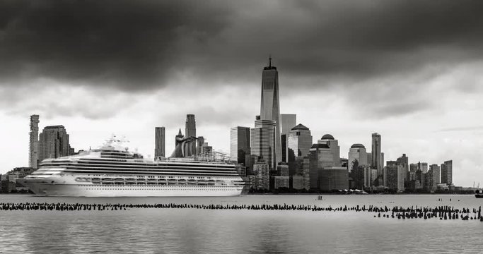 New York City Financial District skyline in Black & White from across the Hudson River. Time lapse of storm clouds over skyscrapers of Lower Manhattan