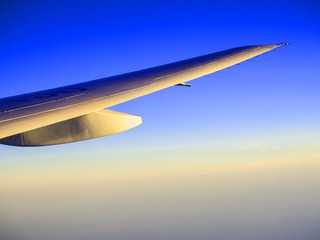 Beautiful sunset sky  when see through the airplane window