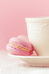 pink macaron homemade on pink background toned, vertical, selictive focus