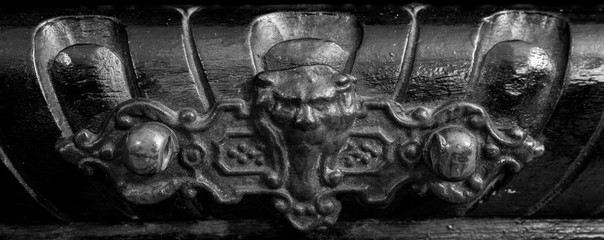 Face-shaped handle on a very old furniture