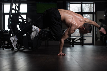 Athlete Doing Extreme Handstand In Gym