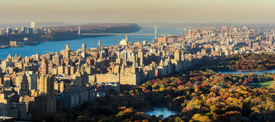 Obraz premium Panoramic elevated view of Central Park, Upper West Side and the George Washington Bridge with Hudson River in Fall. Manhattan, New York CIty