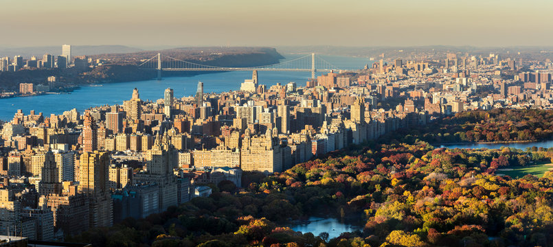 Panoramic elevated view of Central Park, Upper West Side and the George Washington Bridge with Hudson River in Fall. Manhattan, New York CIty