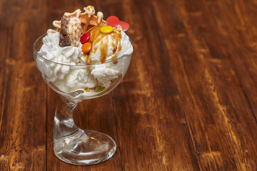 Ice cream cocktail in bowl with syrup and other treats