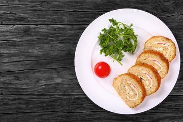 fish roll-up with crab meat cut in slices