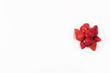 High angle view on Japanese strawberries on white background.