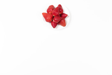 High angle view on Japanese strawberries on white background.