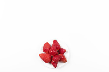 High angle view on Japanese strawberries on white background.