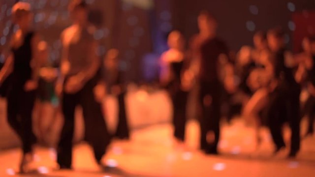 Blurred background of dancers dancing ballroom dances on competitions in 4K