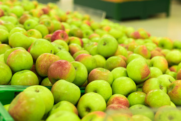 Background of apples on sale at the local organic market of tropical Bali island, Indonesia.