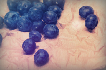 Fresh blueberries on a rustic brown paper background