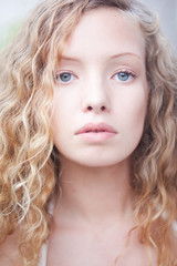 Naklejka premium Portrait of Curly Blond woman