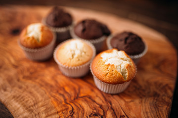 Cakes with sugar and chocolate powder closeup view