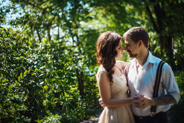 Fototapeta premium a young couple walks in the Park on a sunny day