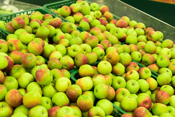 Background of apples on sale at the local organic market of tropical Bali island, Indonesia.
