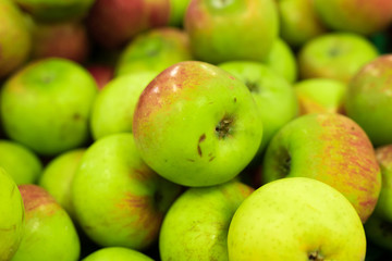 Background of apples on sale at the local organic market of tropical Bali island, Indonesia.