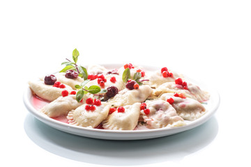 Sweet boiled dumplings with cherries and berries
