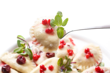 Sweet boiled dumplings with cherries and berries