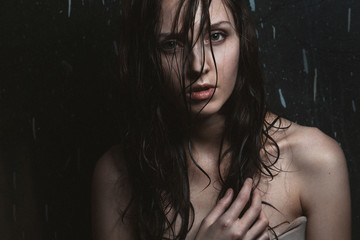 Portrait of Beautiful girl with wet hair and bare shoulders