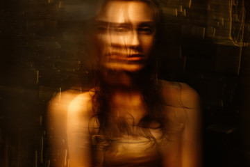 Portrait of Beautiful girl with wet hair and bare shoulders with blur