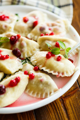 Sweet boiled dumplings with cherries and berries