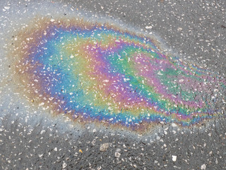 Gasoline stain on wet asphalt