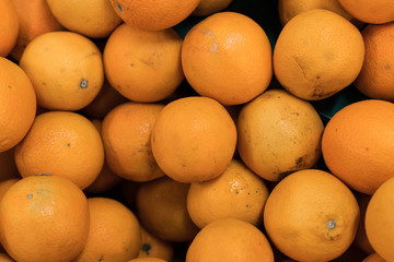 Fresh oranges on a local organic farm market on a tropical Bali island, Indonesia. Oranges background.