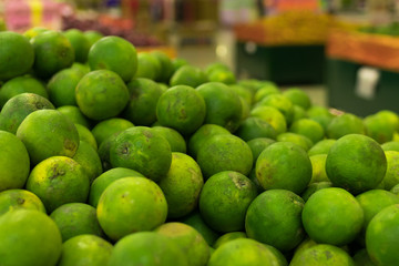 Green fresh Mandarins on a local organic farm market of tropical Bali island, Indonesia. Mandarin background.