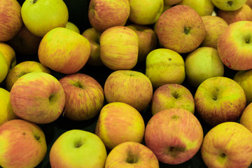 Fresh apples background. Apples on a local organic farm market of Bali island, Indonesia.