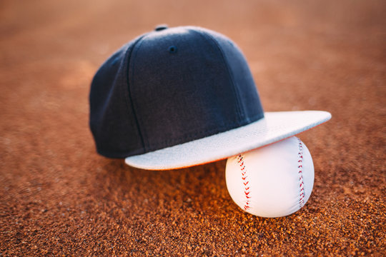 Baseball cap and ball