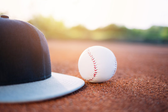 Close up of baseball cap and ball