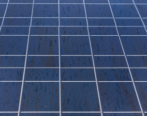 detail of a large solar panel catching the power of the sun

