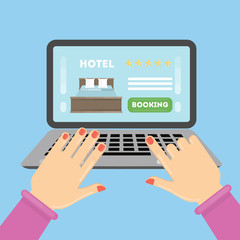 Online hotel booking. Female hands typing on the laptop to book a roomin the hotel.
