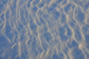 Abstract snowy background in the evening sunlight