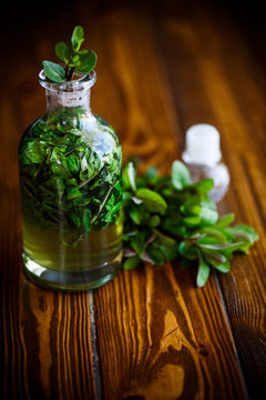 Mint syrup in a glass bottle