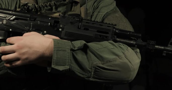 Soldier holding AK-47 assault rifle
