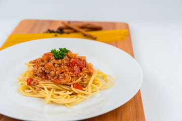 spaghetti pork sauce on white dish