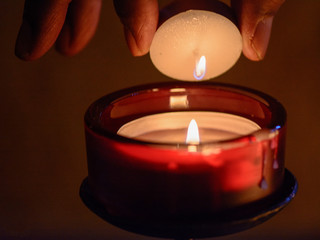 red candle in the dark
