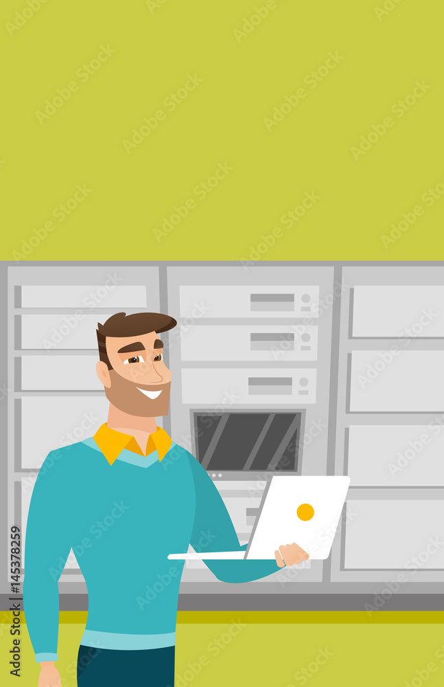 Poster engineer working on laptop in network server room.