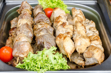 Different kinds of meat, kebab on skewers. Street festival food.