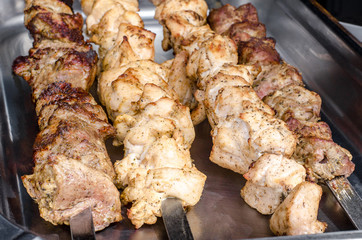 Different kinds of meat, kebab on skewers. Street festival food.