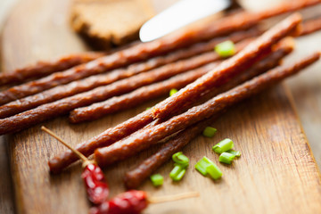 Fresh kabanos sausages, pepper and onion