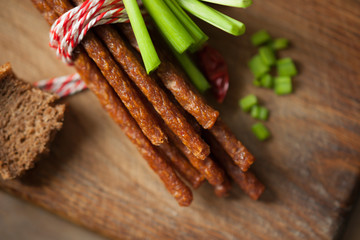 Fresh kabanos sausages, bread and onion 