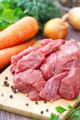 Raw meat with spices and vegetables ready for cook