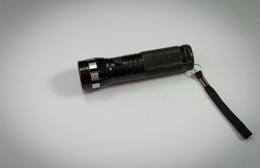 Fototapeta premium Black police flashlight isolated on white background