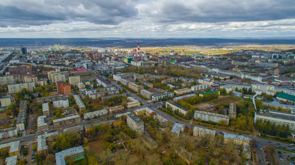 Typical city of Russia at sunset in center. Aerial view