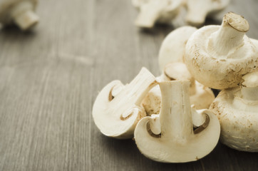 Champignons on a wooden board closeup