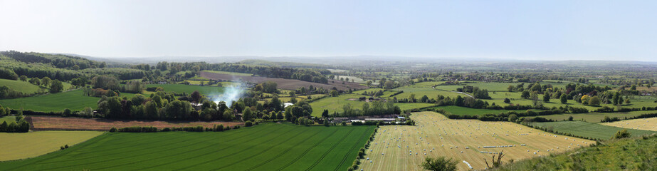 Fototapeta na wymiar Panoramic view from Cley Hill to the fields and farms, Wiltshire, England.