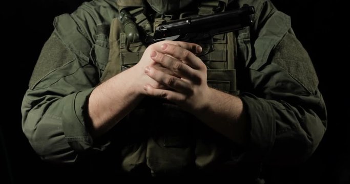 soldier shoots a pistol, recharges a gun